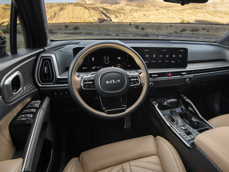 The 2025 Kia Sorento is a three row family SUV that received interior ambiance upgrades and new all-terrain wheels for driving.