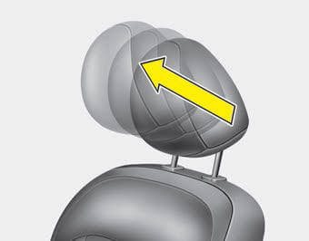 gray car headrest with arrow on it for adjustment